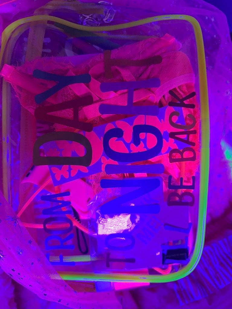 Neon sign glowing pink purple blue